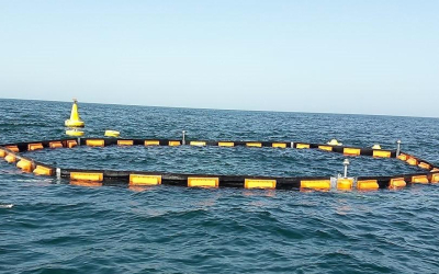 Manufacture and installation of permanent oil and debris barrier around desalination intake screens.